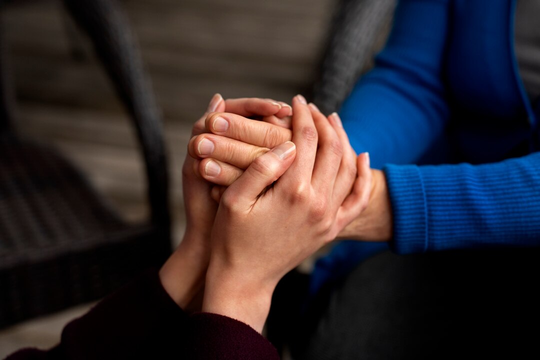 hands holding each other support 23 2150445969